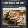 Book cover of 'Lemon Blueberry Honey' from The Sourdough Lab with sliced bread and honey on a wooden surface.